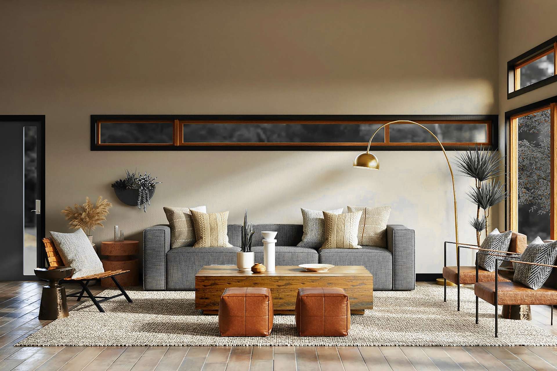 Sala amplia con sofá gris, mesa de madera y grandes ventanales
