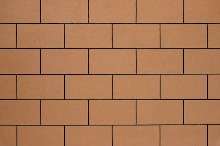 Muro de ladrillos cerámicos color terracota