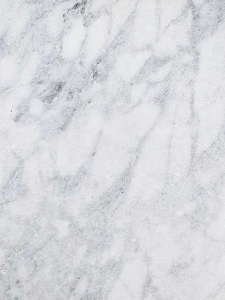 Superficie de mármol blanco con vetas grises