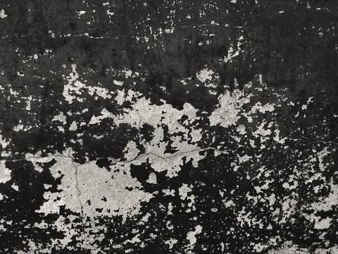 Pared negra con manchas de pintura blanca descascarada