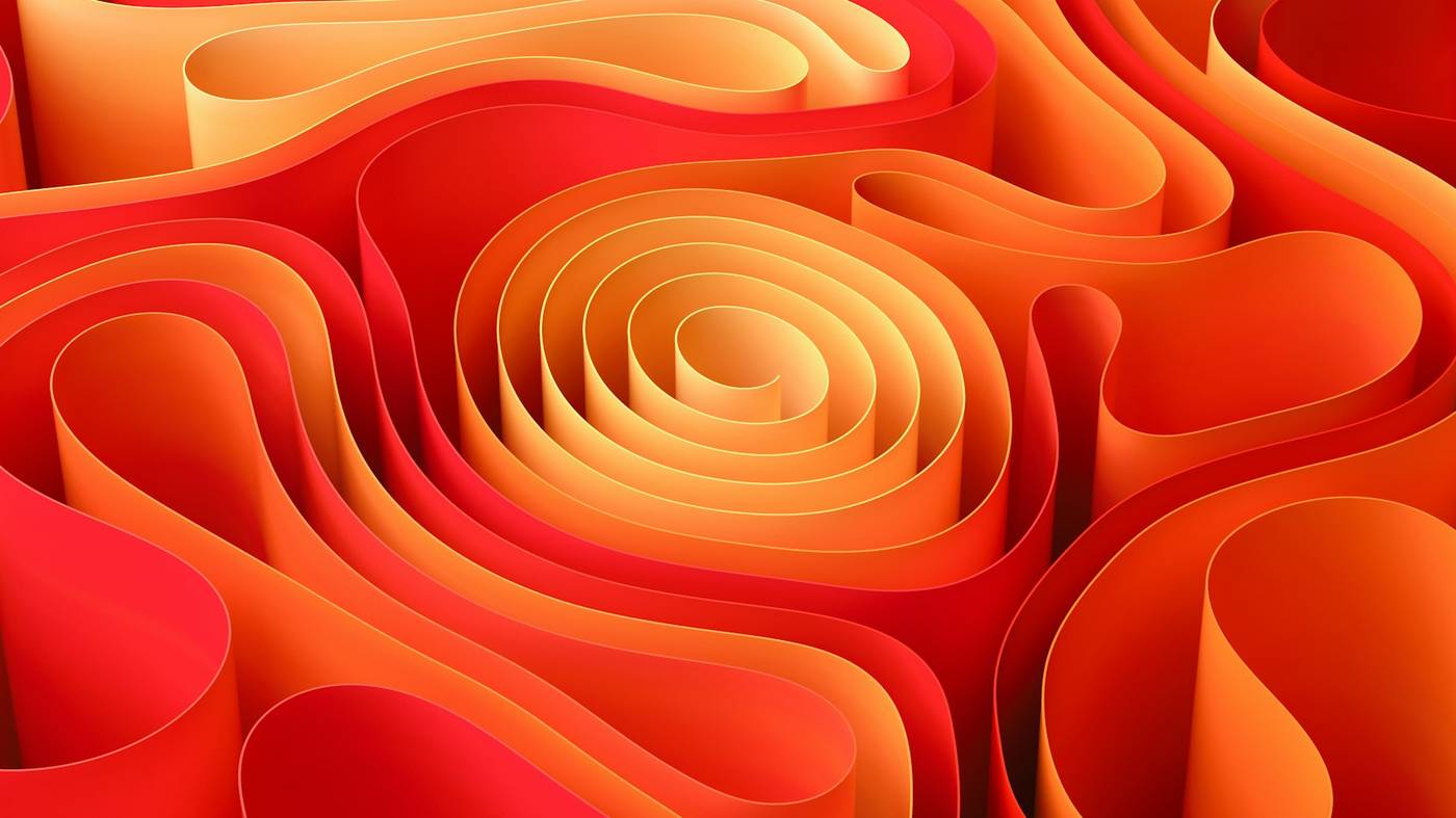 Capas de papel rojo y naranja formando ondas