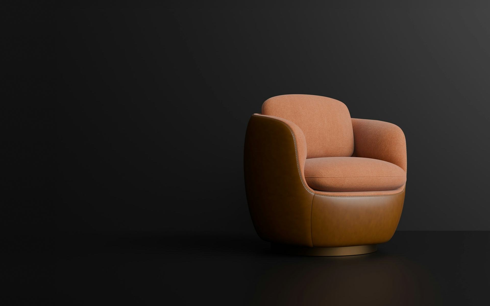 Brasa: sillón de cuero y paño sobre fondo oscuro